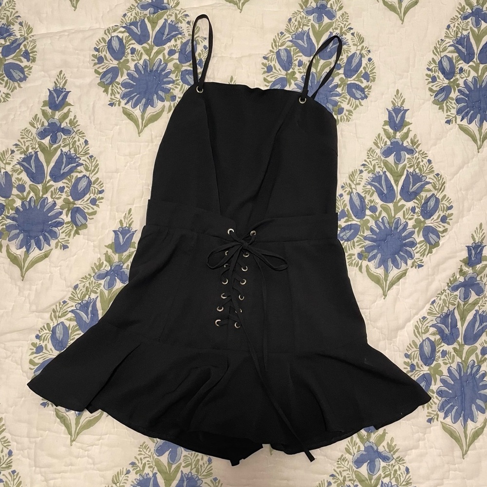 NEW- Black romper with tie waist. Size small. New with tags!
